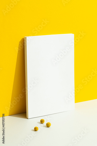 Blank ehite magazine mockup on yellow background photo