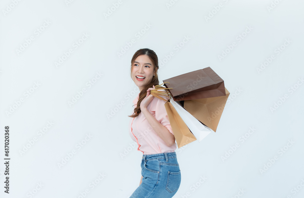 Beautiful asian woman holding shopping bags isolated on white background. Beautiful asian woman holding shopping bags isolated on white background.