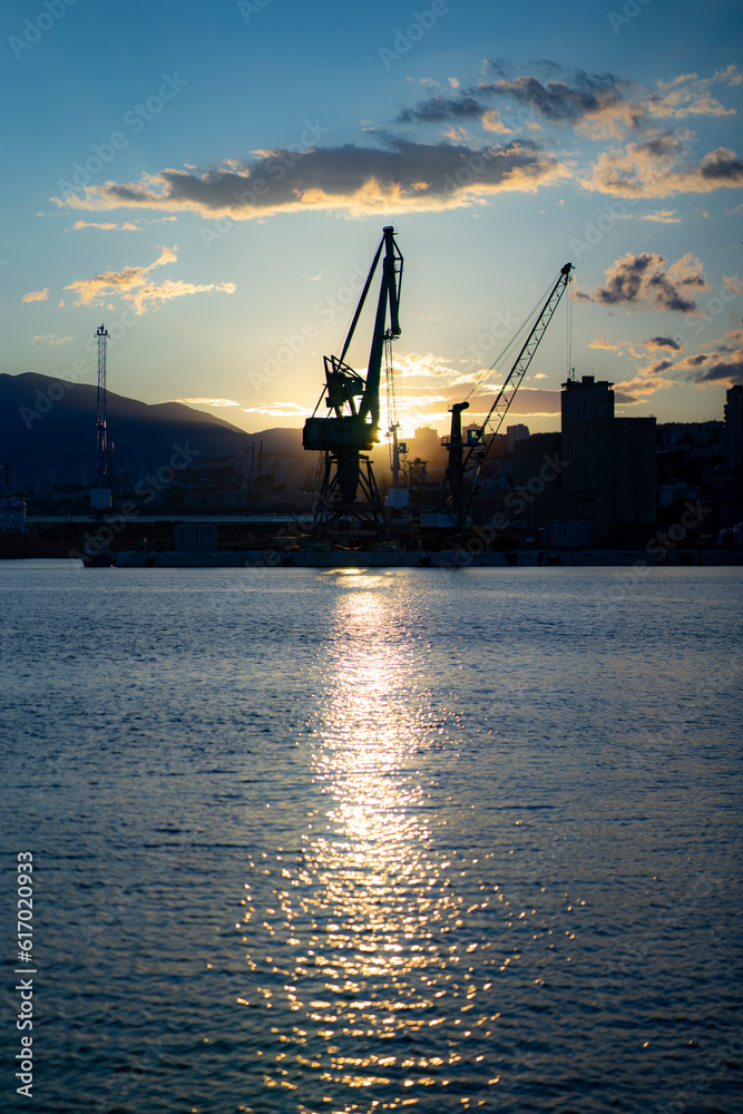 industrial port on the Adriatic coast at dusk, early summer