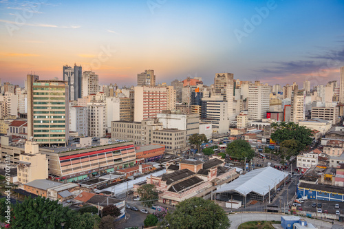 Campinas, Sao Paulo, Brazil. June 23, 2023. Aerial image of three central districts of Campinas: Vila Itapura, Cambuí and Jardim Guanabara. Sunset and blue sky. photo