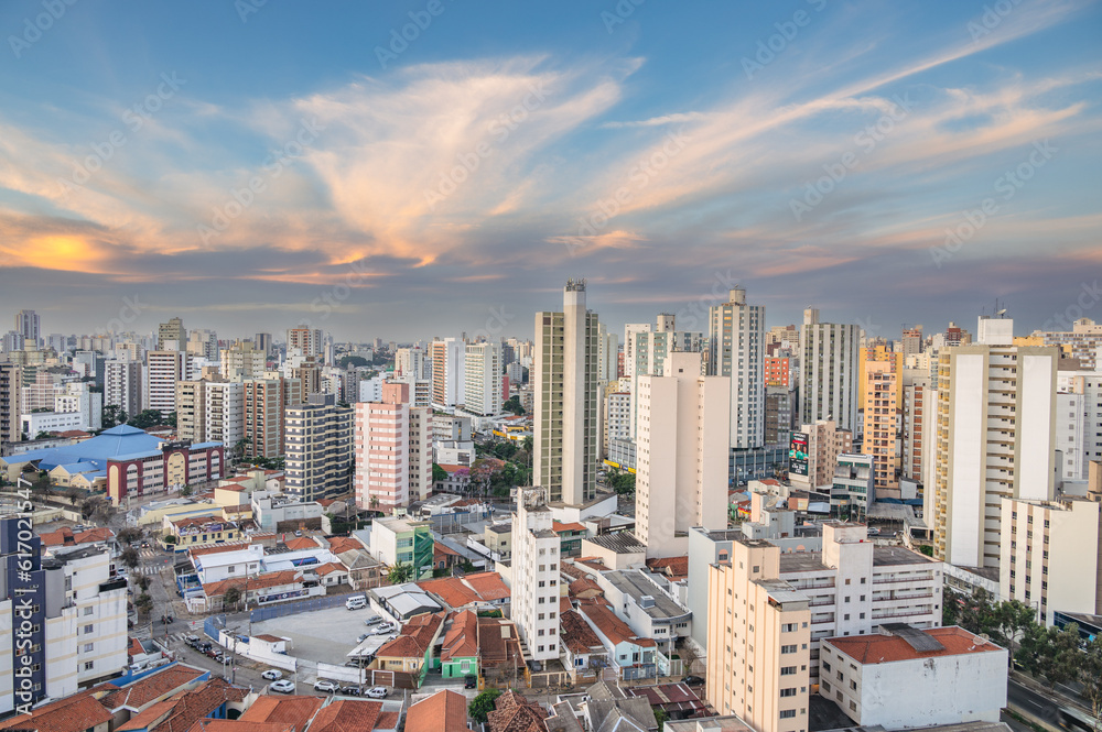 Obraz premium Campinas, Sao Paulo, Brazil. June 23, 2023. Aerial image of three central districts of Campinas: Vila Itapura, Cambuí and Jardim Guanabara. Sunset and blue sky.