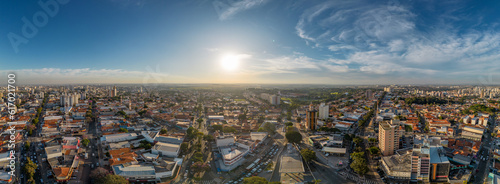 Campinas, Sao Paulo, Brazil. June 23, 2023. Aerial image of three central districts of Campinas: Vila Itapura, Cambuí and Jardim Guanabara. Sunset and blue sky. © Paulo
