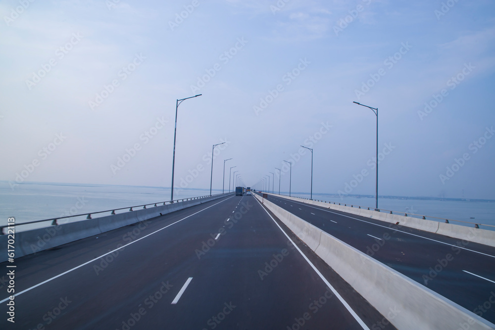Padma Bridg Highway asphalt with blue sky Background. Perspective view