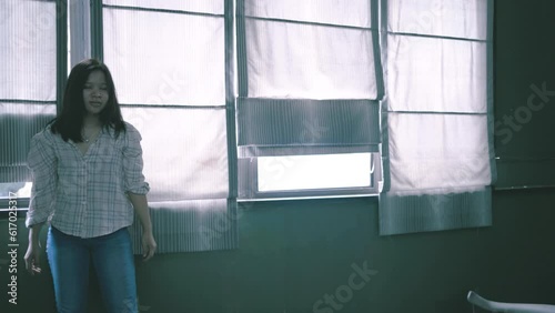 Woman walking alone at night in dark . Male in hooded jacket robbing female and stealing her bag. Criminal taking the bag and running away to darkness.