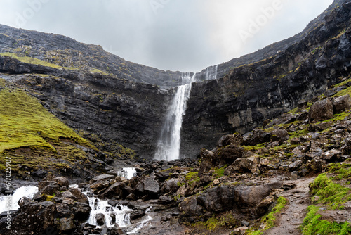 Fototapeta Naklejka Na Ścianę i Meble -  A great waterfall in the mountains og the Faroe Islands