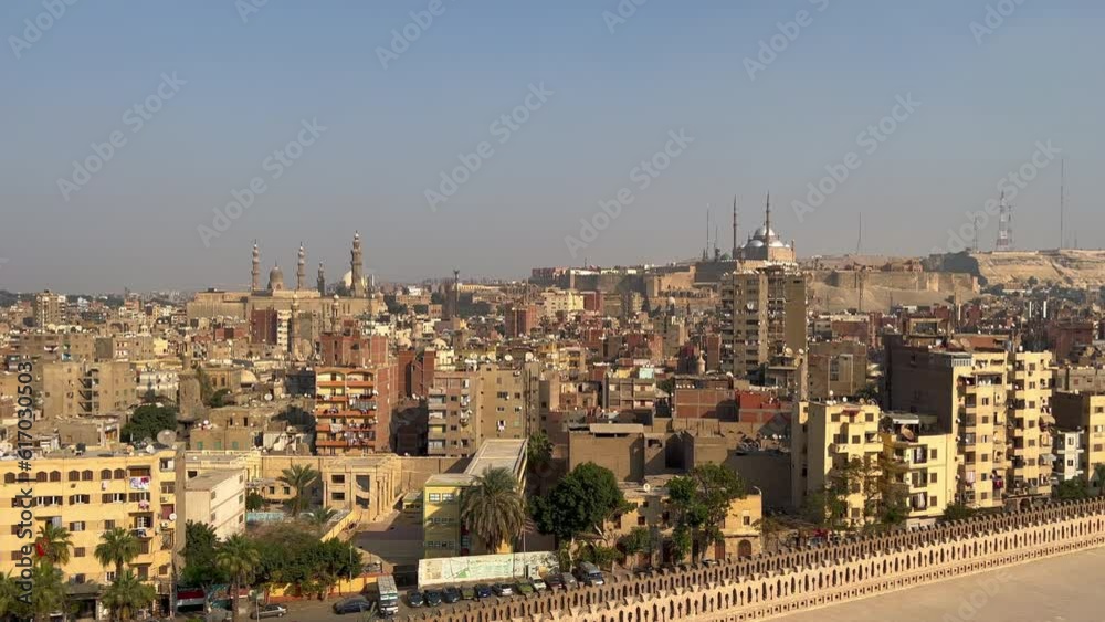 Aerial static panoramic view cityscape with apartments and mosque on hilltop.Historical heritage sites. Egypt capital Cairo buildings architecture.North africa Aerial static panoramic view cityscape with apartments and mosque on hilltop.Historical heritage sites. Egypt capital Cairo buildings architecture.North africa