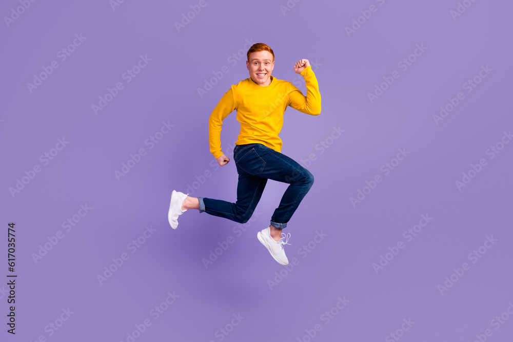 Full length profile photo of cheerful man run look empty space isolated on purple color background