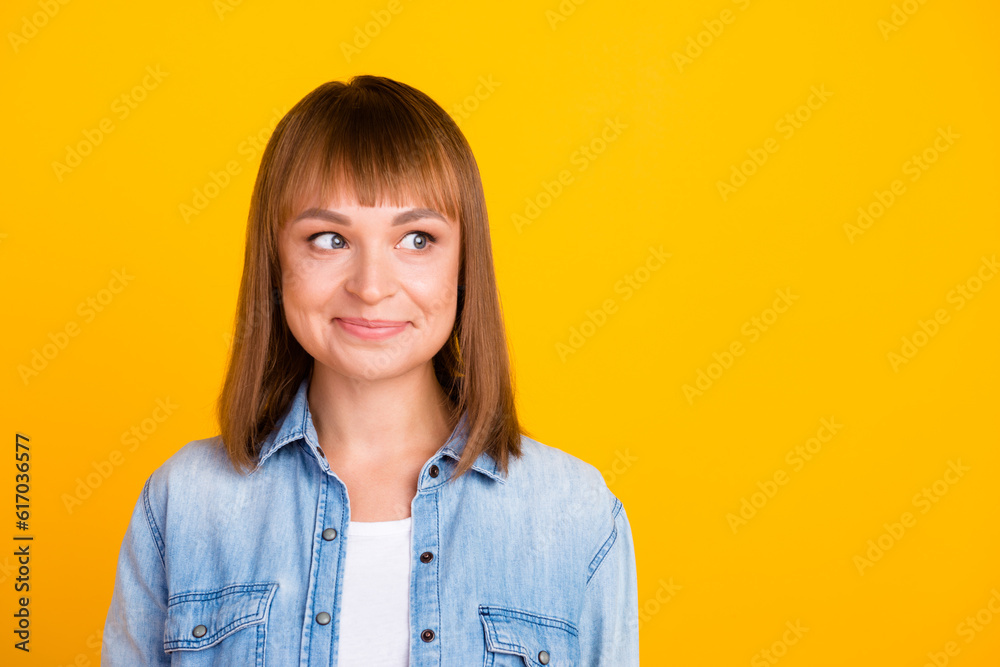 Fototapeta premium Pretty smiling joyfully female with fair hair dressed casually looking with satisfaction at camera isolated against blank studio wall