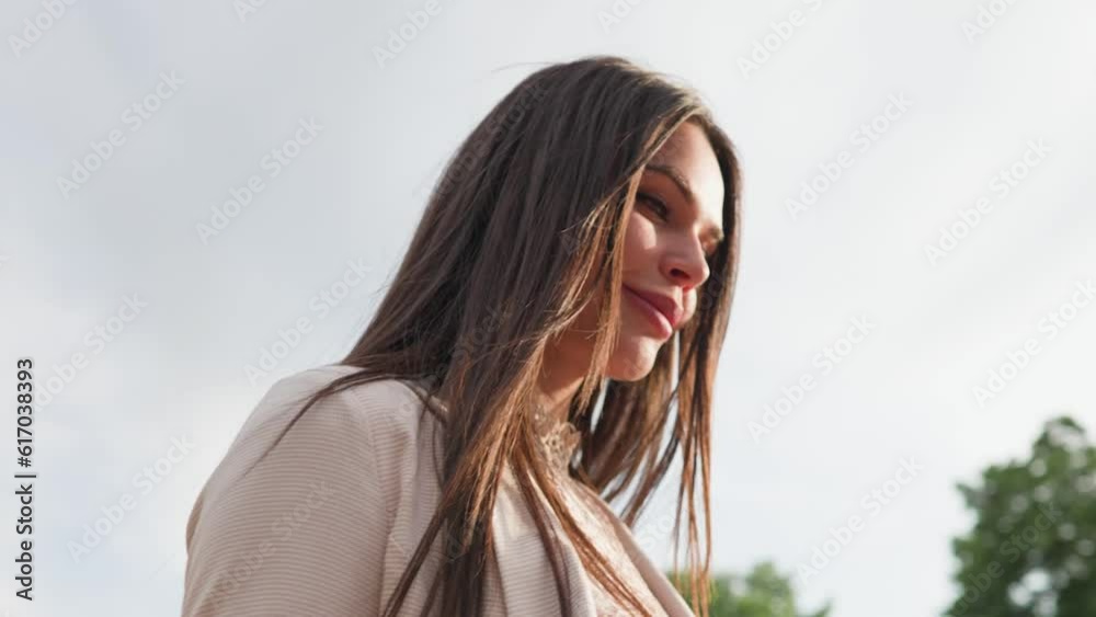 Attractive Happy Brunette Woman Walks around the City on Sunny Day. Beautiful Girl Smiles and Walks Confidently along Urban Street. Concept of Female Beauty and Wellbeing. Slow Motion Attractive Happy Brunette Woman Walks around the City on Sunny Day. Beautiful Girl Smiles and Walks Confidently along Urban Street. Concept of Female Beauty and Wellbeing. Slow Motion