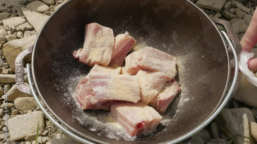 pork ribs in a cauldron of adding spices pork ribs in a cauldron of adding spices