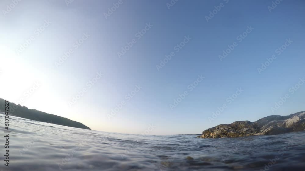 camera dipping under the water at the waters edge on the beach camera dipping under the water at the waters edge on the beach