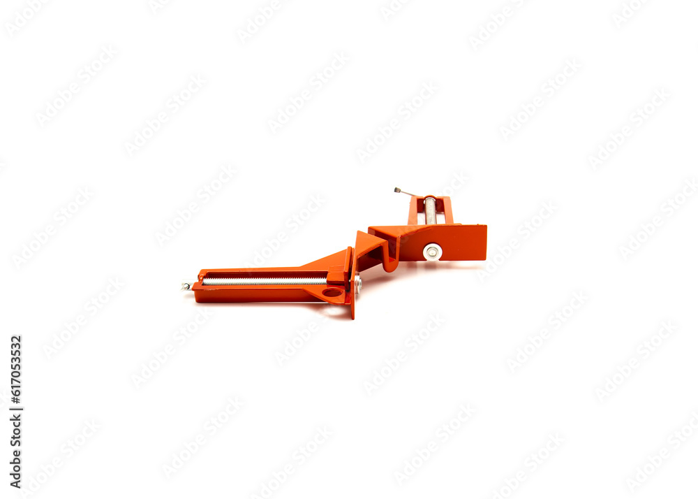 Top view brand new corner clamp in red enamel finish with 90-degree angle hold, steel lead screws, sliding t-handles made of cast aluminum frame isolated on while background