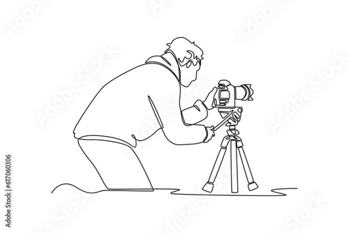 Single one line drawing  Photographer with camera. World photography day concept. Continuous line draw design graphic vector illustration.