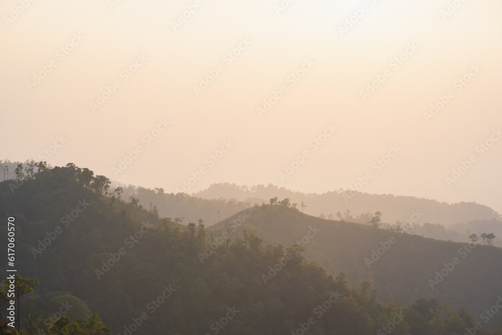 silhouette and panorama layer of mountain with sunset background