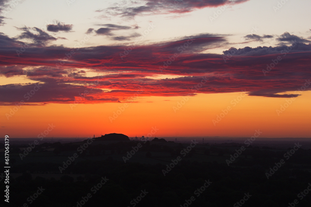 Crimson Horizon: Intensely Red Sunrise Captured