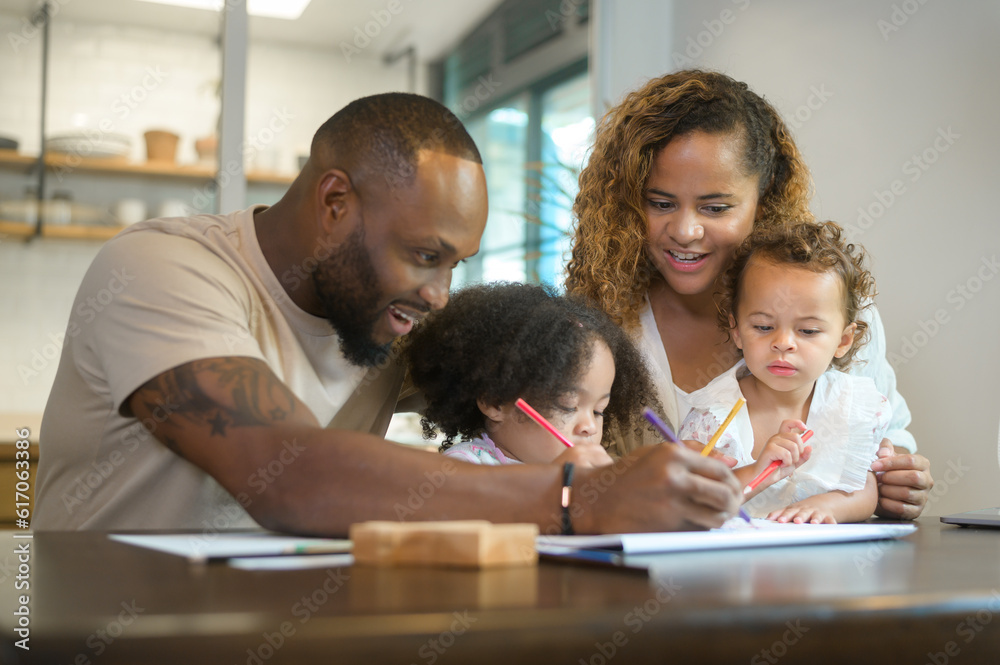 Happy African American parent playing and drawing with daughters in home Happy African American parent playing and drawing with daughters in home