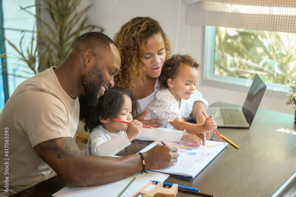 Happy African American parent playing and drawing with daughters in home Happy African American parent playing and drawing with daughters in home
