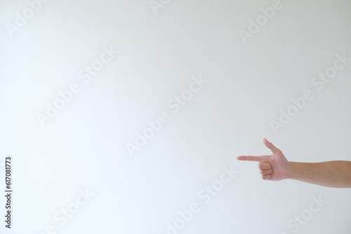 A hand on the right side is pointing to the left side. Isolated white background.