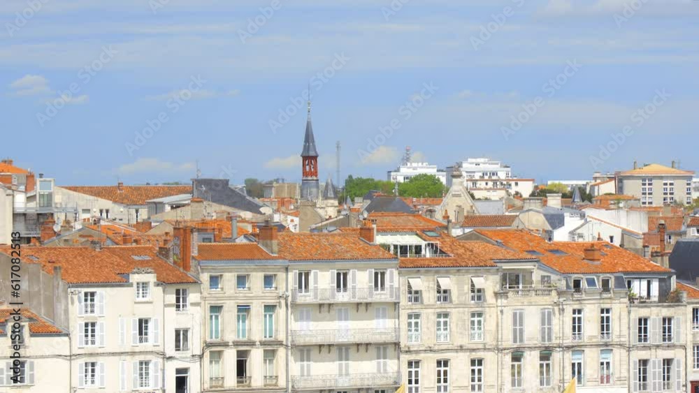Buildings of the Old Port and clock tower of the Hotel de Ville, the city hall of La Rochelle, France Buildings of the Old Port and clock tower of the Hotel de Ville, the city hall of La Rochelle, France