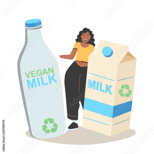 The girl holds the milk. Plastic bottle with label and carton with vegan plant based milk.