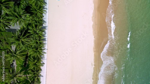 Beautiful cloudscape over the sea, sunset shot. Top down bird's eye view stunning aerial view of Nha Trang city beach, Vietnam. Asia. Drone flew over the sea and flies to the coastal city, coastline photo