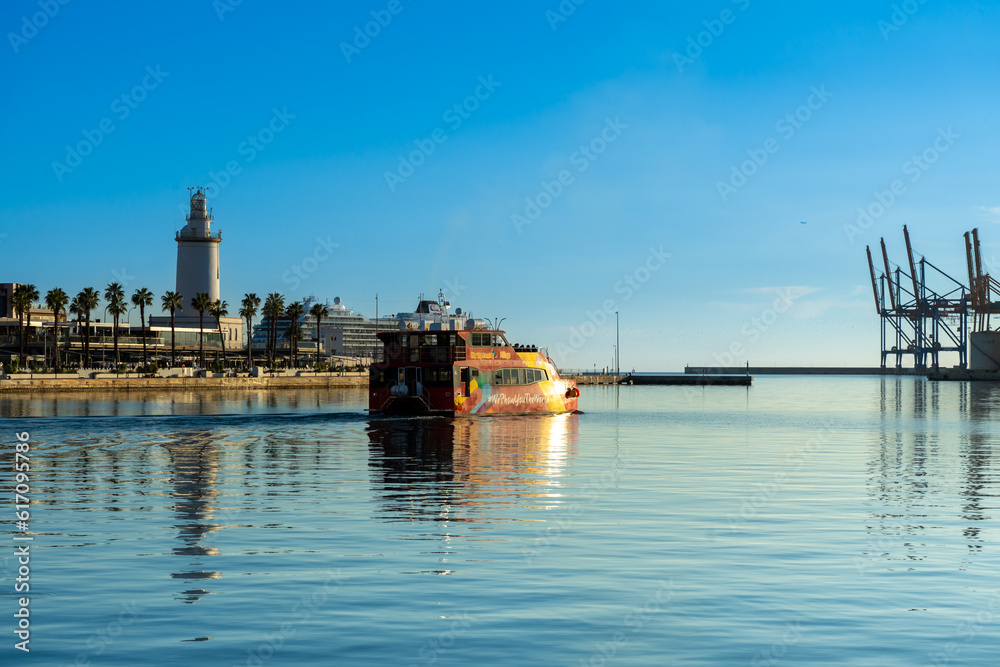 Catamaran cruise on sunset in port in Malaga, Spain on January 14, 2023