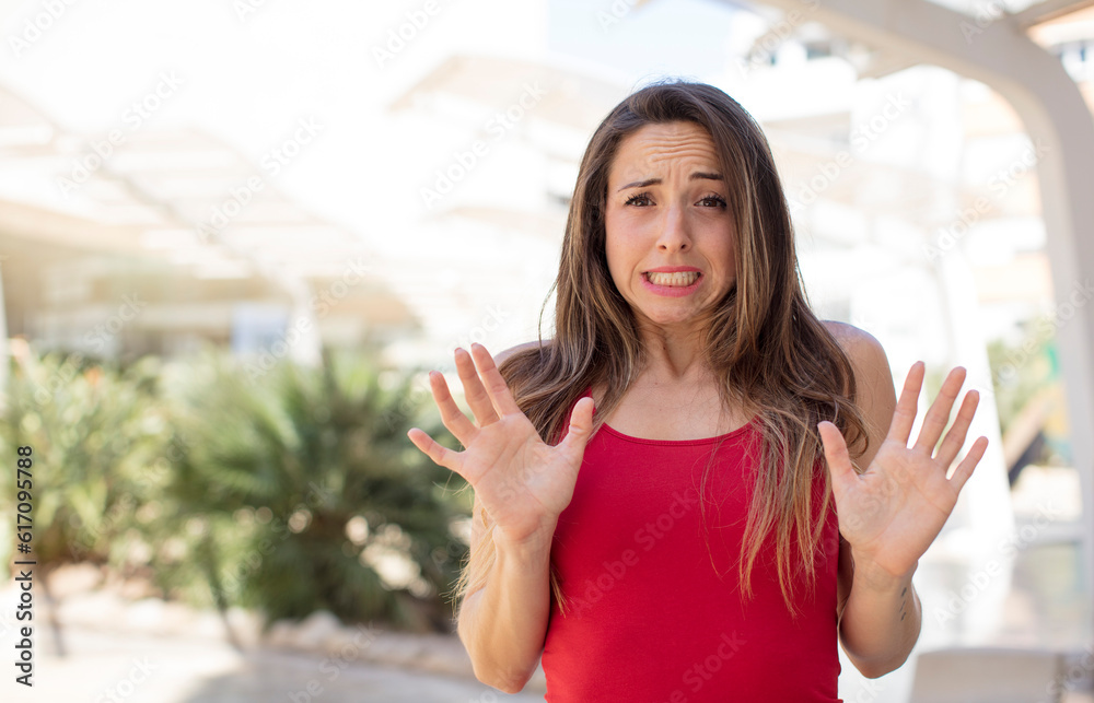 pretty woman feeling disgusted and irritated, sticking tongue out, disliking something nasty and yucky pretty woman feeling disgusted and irritated, sticking tongue out, disliking something nasty and yucky