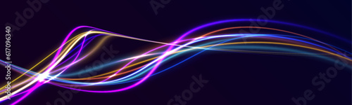 Abstract neon color wave lights background. Dynamic composition of bright lines forming lights path of speed movement, futuristic dark background, graphic design element 