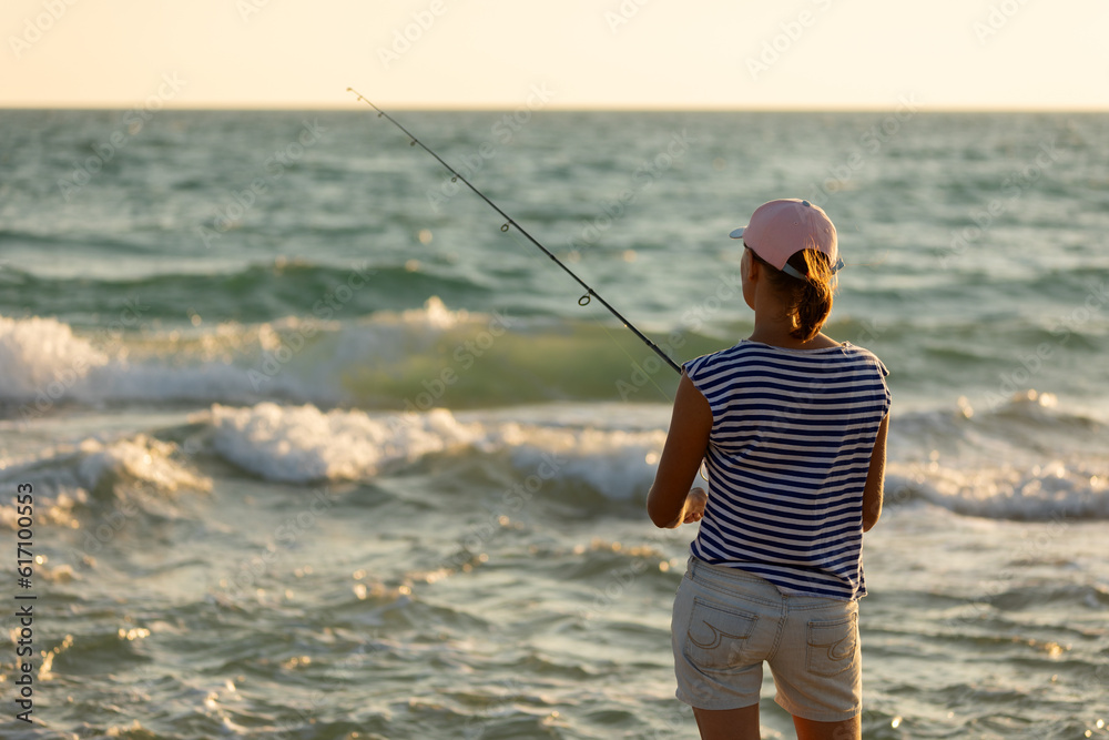 Woman fishing in the sea with a line Woman fishing in the sea with a line