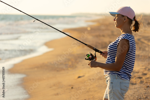 Woman fishing in the sea with a line