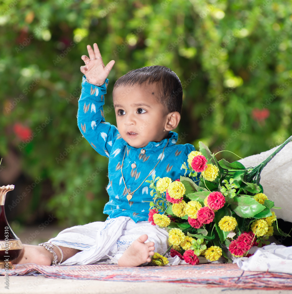 Beautiful little baby, little baby with a happy face and background green. cute Indian baby Beautiful little baby, little baby with a happy face and background green. cute Indian baby