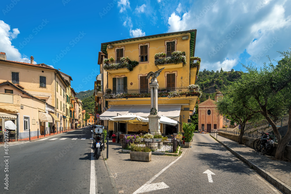 Two urban streets and small outdoor restaurant in Dolceacqua, Italy.