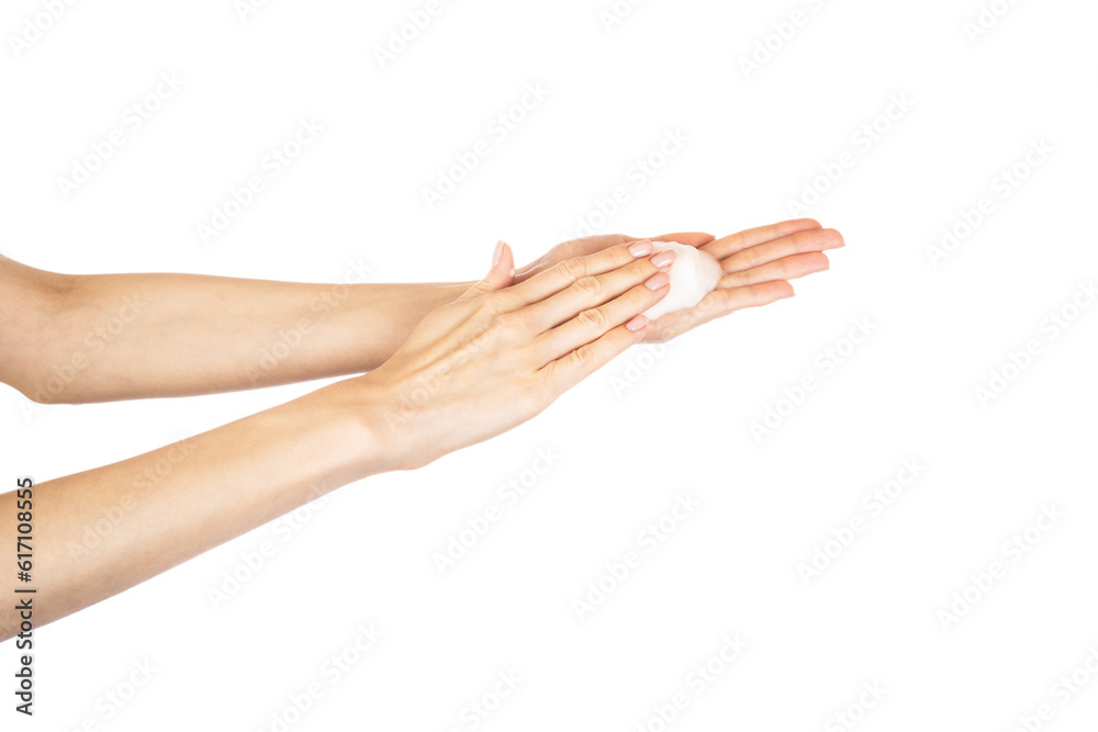 Woman thoroughly washing her hands isolated on white background. Soap foam on female hands.