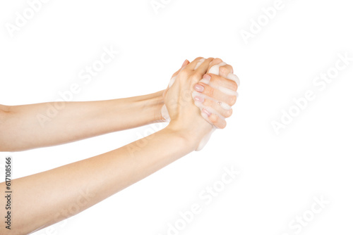 Woman thoroughly washing her hands isolated on white background. Soap foam on female hands.