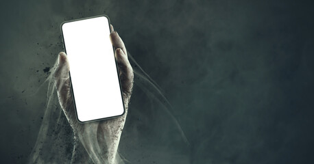 Zombie hand holding a smartphone