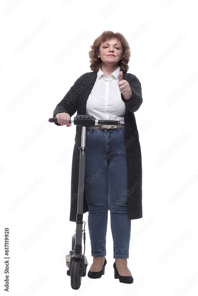 in full growth. modern adult woman with an electric scooter in full growth. modern adult woman with an electric scooter