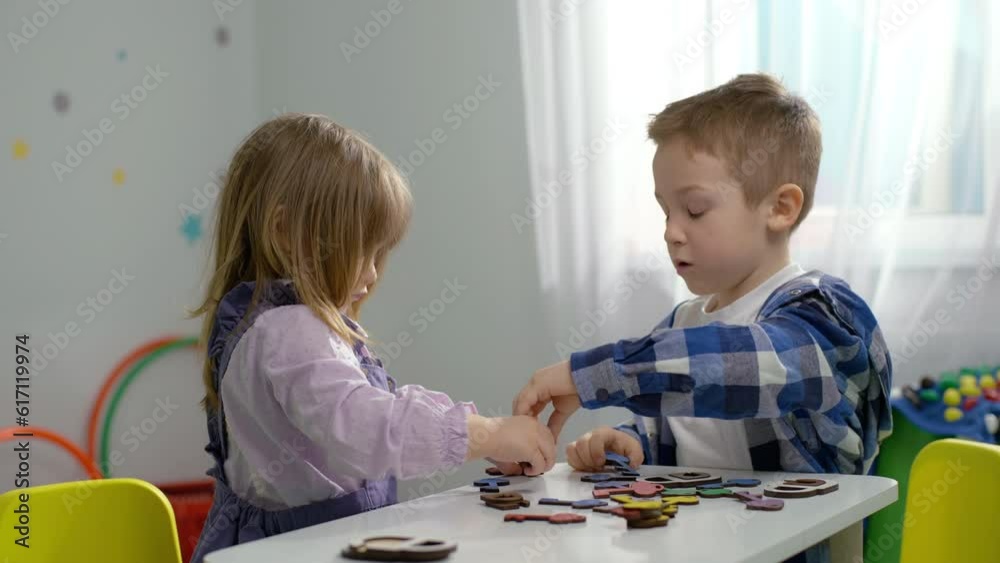 Lives have fun playing games for the development of logic in kindergarten. Wise generation, development of children's thinking. The boy and the girl are smart. High quality 4k footage Lives have fun playing games for the development of logic in kindergarten. Wise generation, development of children's thinking. The boy and the girl are smart. High quality 4k footage