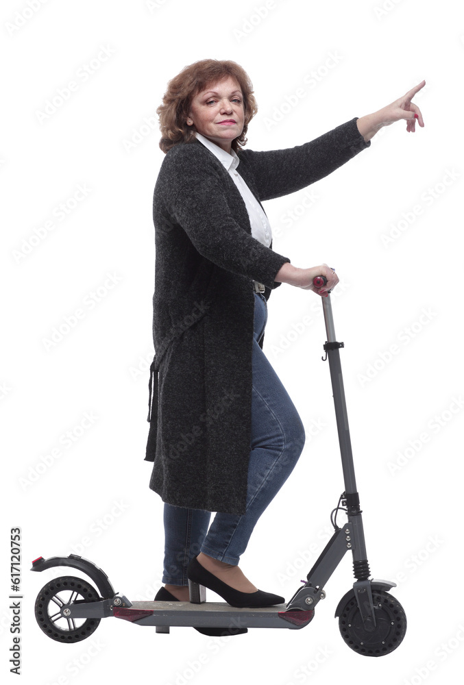side view. confident woman with an electric scooter looking at the camera