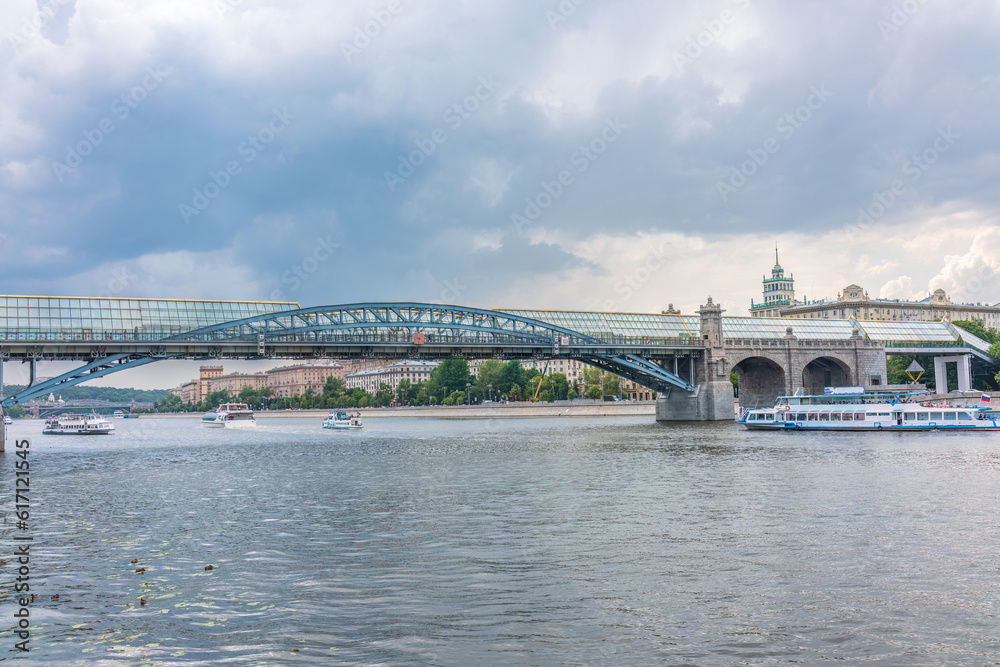 Fototapeta premium View of the Moscow river embakment, Pushkinsky bridge and cruise ships at sunset.