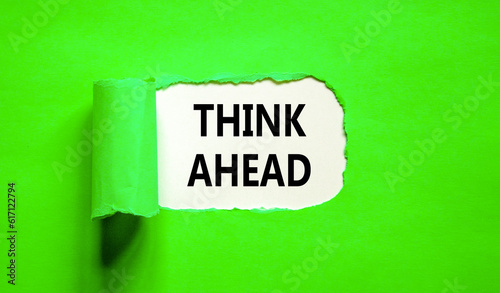 Think ahead symbol. Concept words Think ahead on beautiful white paper on a beautiful green background. Business, support, motivation, psychological and think ahead concept. Copy space.