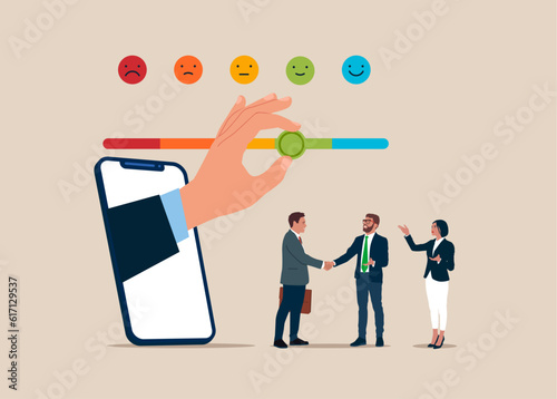 Through the smartphone  pull the arrow to make bar to be excellent smile. Corporate customer feedback with two businessmen doing handshake. Customer feedback, quality from product.