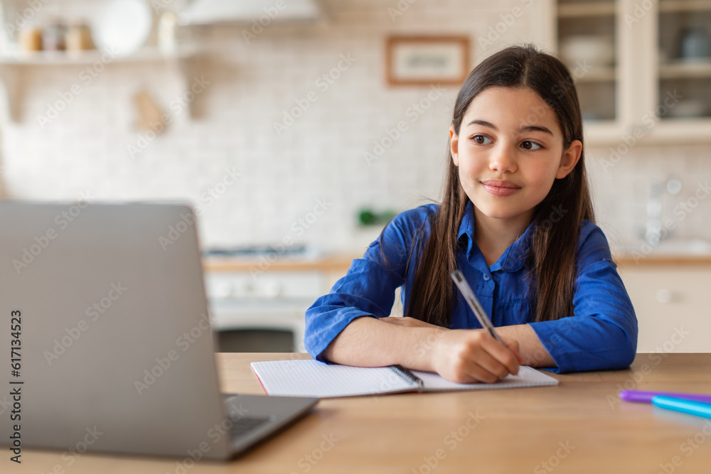 Cute Little School Girl Studying With Laptop And Writing Indoors Cute Little School Girl Studying With Laptop And Writing Indoors