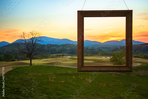 A frame in front of the scenery of a golf course in the North Georgia Mountains