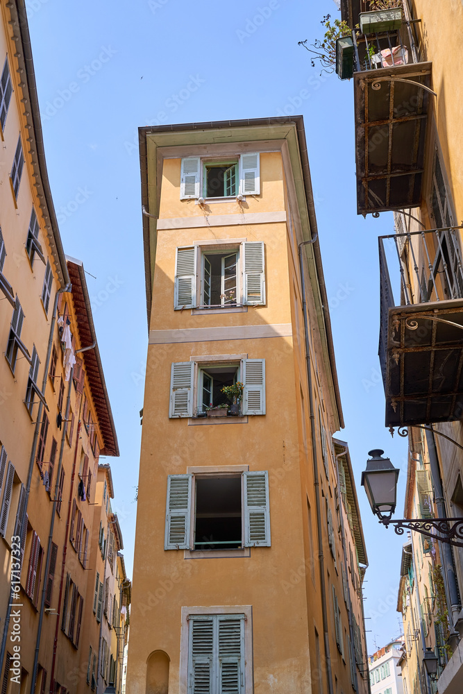 Old Town of Nice city in France, narrow apartment building with shuttered windows n historical district Vieille Ville
