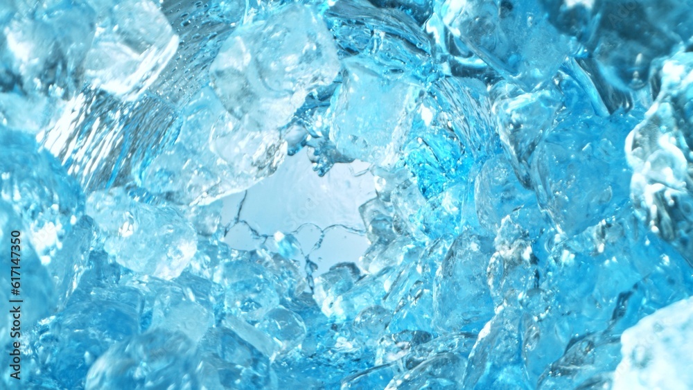 Texture of splashing water with ice cubes, tunnel shape.