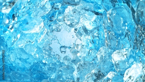 Texture of splashing water with ice cubes, tunnel shape.
