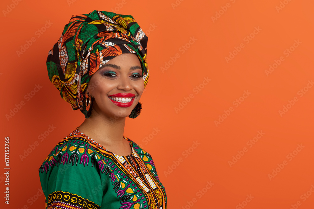 Attractive young african lady in traditional clothing, copy space