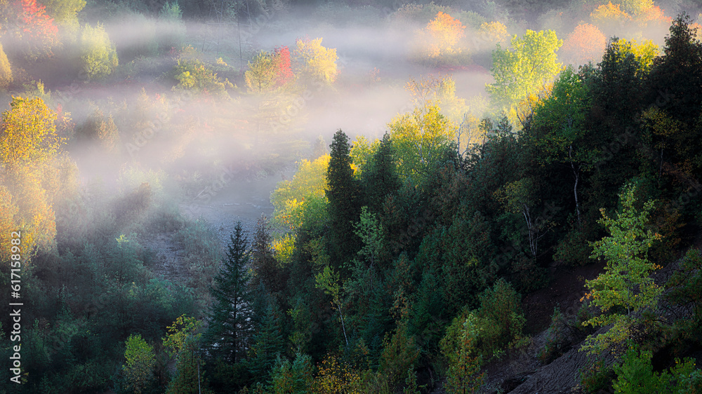 Autumn scenery of Rogue River Valley in a early morning with fog and mist