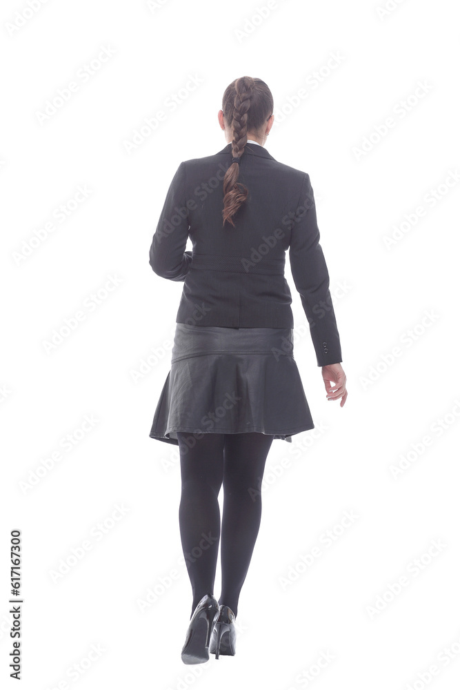 in full growth. confident businesswoman striding forward