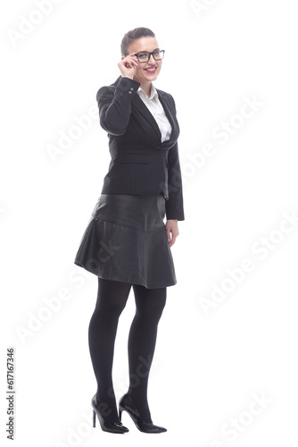 in full growth. smiling businesswoman looking through glasses